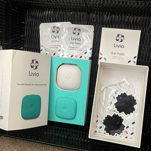 Livia menstrual pain relief machine + 8 new pads
